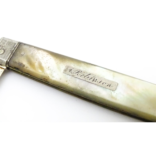 345 - A 19thC silver folding fruit knife with mother of pearl handle. Hallmarked Sheffield 1833 maker Nath... 