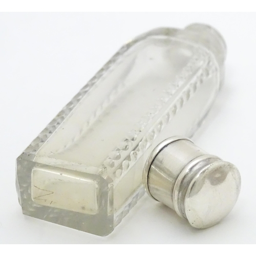 348 - A Georgian cut glass perfume / scent bottle of squared form with white metal lid. Approx. 3 1/2