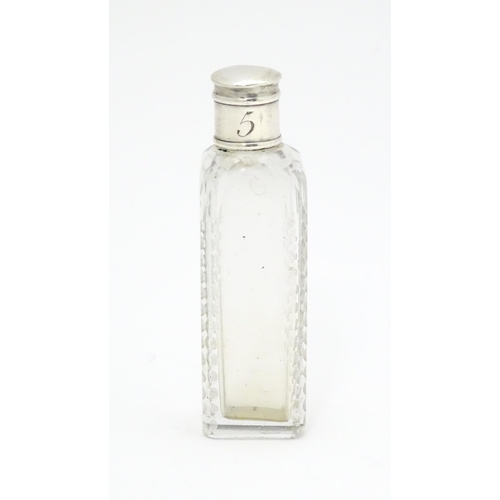 348 - A Georgian cut glass perfume / scent bottle of squared form with white metal lid. Approx. 3 1/2