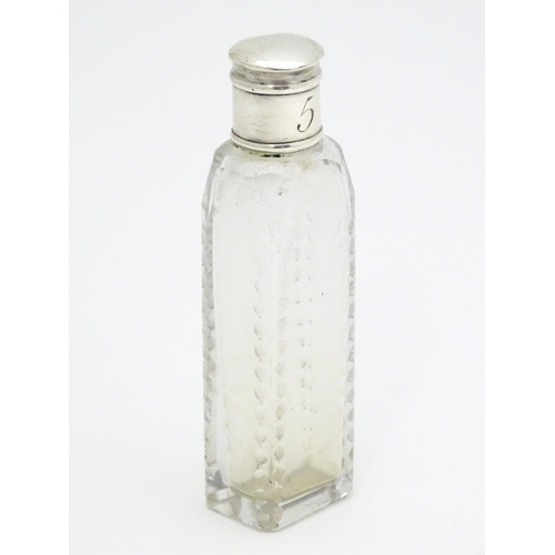 348 - A Georgian cut glass perfume / scent bottle of squared form with white metal lid. Approx. 3 1/2