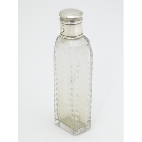 348 - A Georgian cut glass perfume / scent bottle of squared form with white metal lid. Approx. 3 1/2