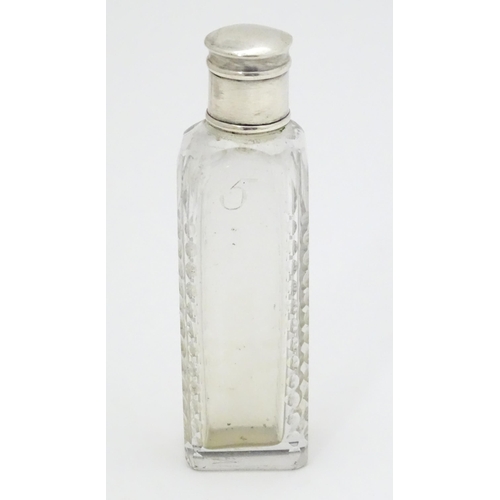 348 - A Georgian cut glass perfume / scent bottle of squared form with white metal lid. Approx. 3 1/2