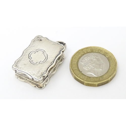 357 - A Victorian silver vinaigrette with engraved decoration and gilded interior. hallmarked Birmingham 1... 