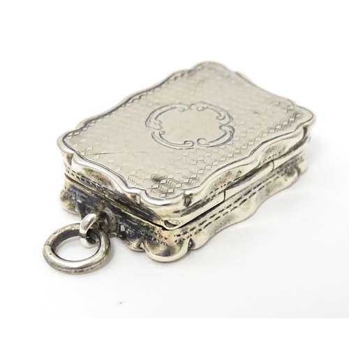 357 - A Victorian silver vinaigrette with engraved decoration and gilded interior. hallmarked Birmingham 1... 