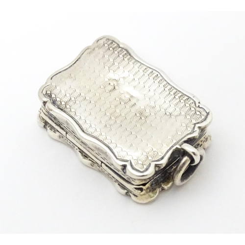 357 - A Victorian silver vinaigrette with engraved decoration and gilded interior. hallmarked Birmingham 1... 