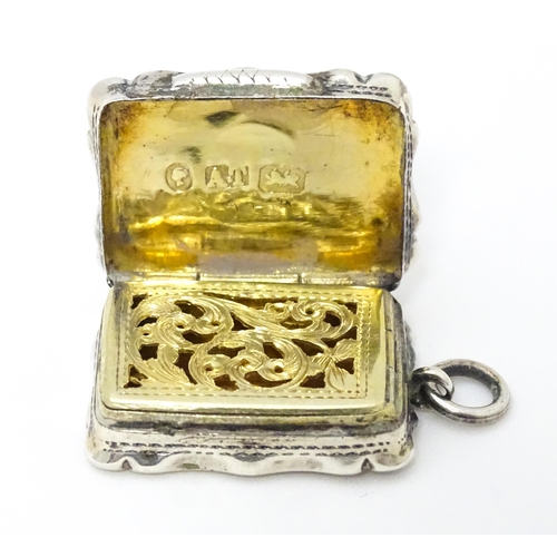 357 - A Victorian silver vinaigrette with engraved decoration and gilded interior. hallmarked Birmingham 1... 