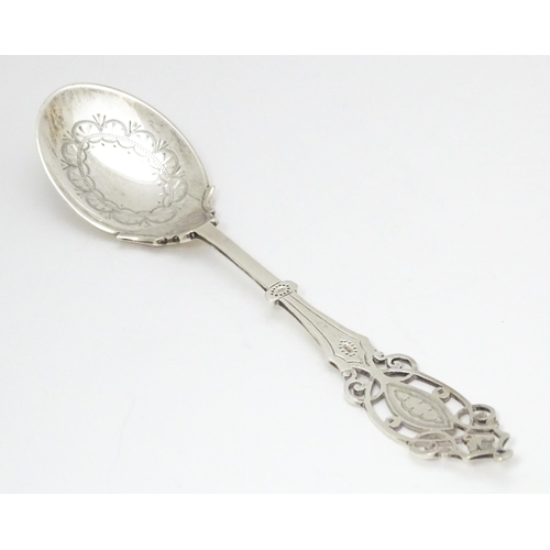 359 - A silver spoon with engraved decoration and open work to handle.  Hallmarked Sheffield 1912 maker Ma... 