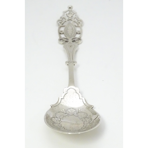 359 - A silver spoon with engraved decoration and open work to handle.  Hallmarked Sheffield 1912 maker Ma... 