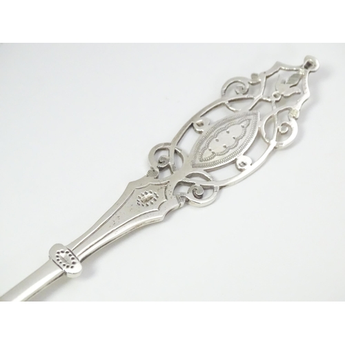 359 - A silver spoon with engraved decoration and open work to handle.  Hallmarked Sheffield 1912 maker Ma... 