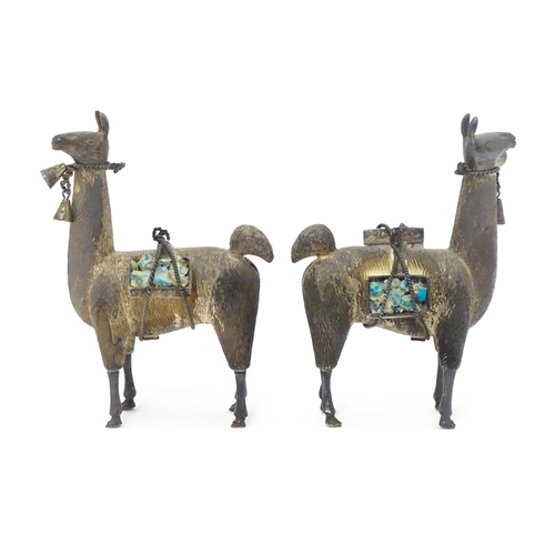 365 - A pair of silver llama figures marked under .950 Possibly Peruvian 3 1/2