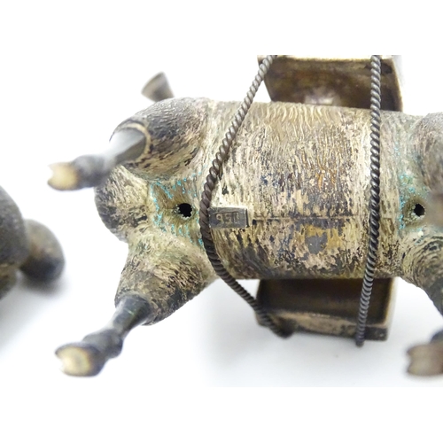 365 - A pair of silver llama figures marked under .950 Possibly Peruvian 3 1/2