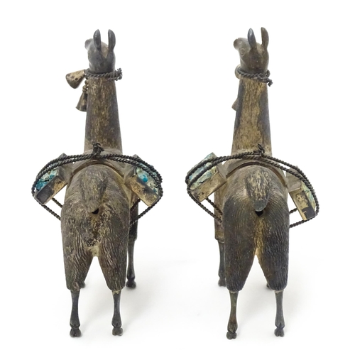 365 - A pair of silver llama figures marked under .950 Possibly Peruvian 3 1/2