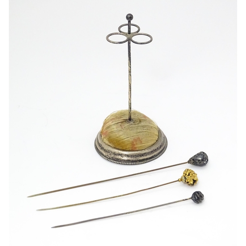 374 - An early American silver hat pin stand together with 3 hat pins. The stand marked under Sterling and... 