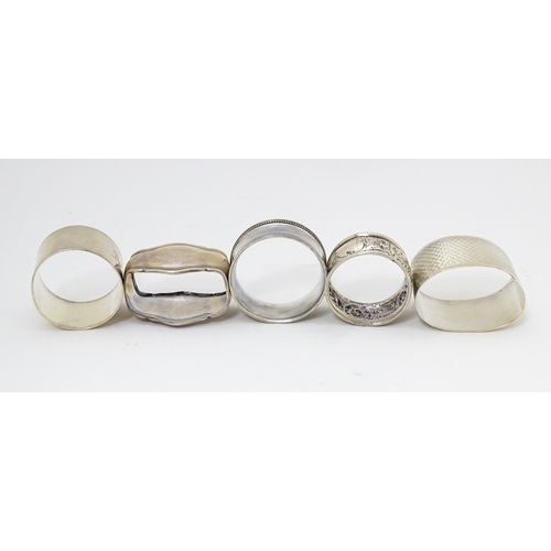 377 - Five assorted napkin rings to include silver examples hallmarked Sheffield 1904, Birmingham 1898, Bi... 