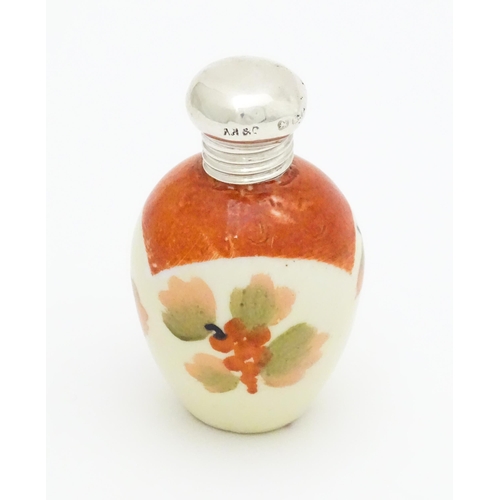 379 - A ceramic miniature scent / perfume bottle with silver mount hallmarked Birmingham  1899 maker A B &... 