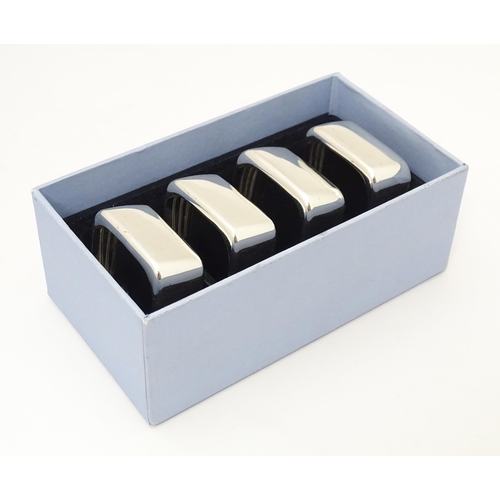 387 - A set of four 'capri' pattern silver plate napkin rings. Produced for Wedgwood.