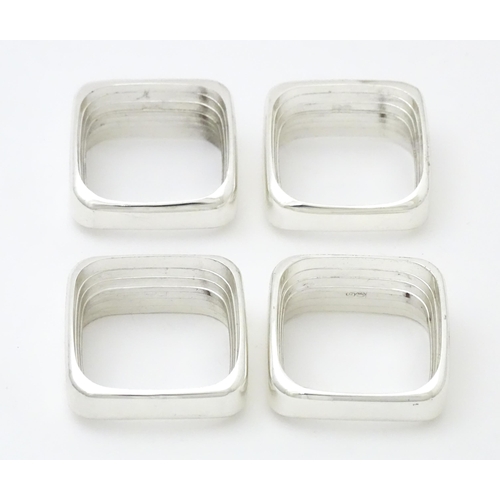 387 - A set of four 'capri' pattern silver plate napkin rings. Produced for Wedgwood.