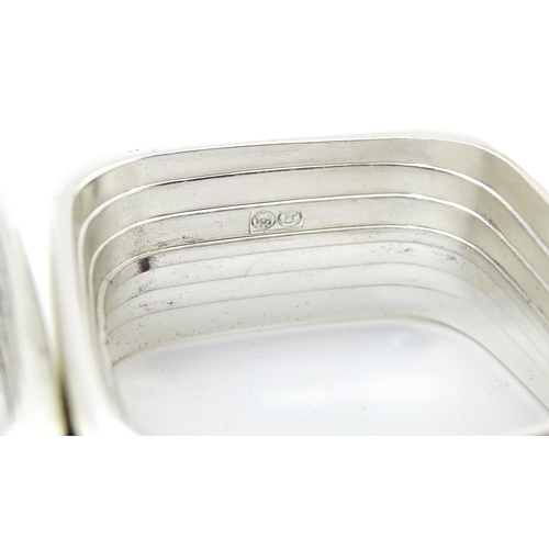 387 - A set of four 'capri' pattern silver plate napkin rings. Produced for Wedgwood.