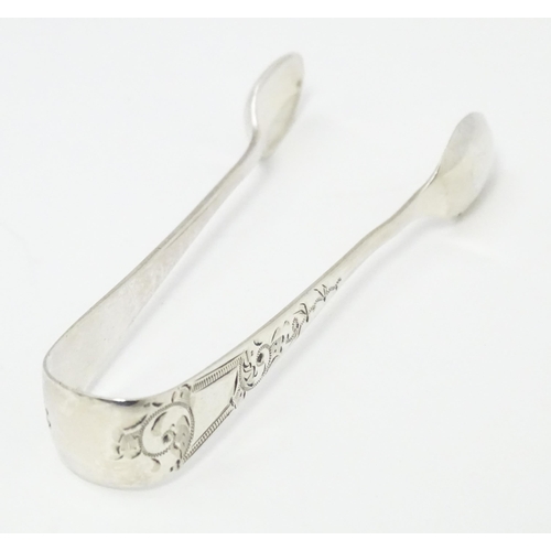 419 - Silver sugar tongs with engraved decoration, hallmarked Sheffield 1896, maker James Deakin & Sons. A... 