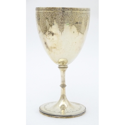 426 - Rowing Interest - Oarsman Walter Bradford Woodgate : A Victorian silver goblet formed trophy cup wit... 