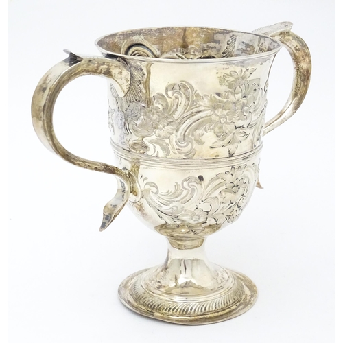 431 - A Geo III silver twin handled cup  with floral and foliate scroll decoration. Hallmarked London 1788... 