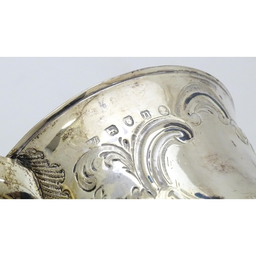 431 - A Geo III silver twin handled cup  with floral and foliate scroll decoration. Hallmarked London 1788... 