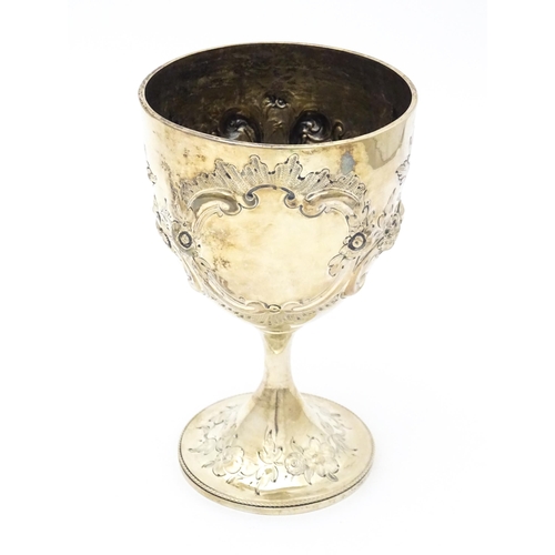 434 - A Victorian silver cup / chalice / goblet with floral and scroll decoration. Hallmarked London 1860 ... 