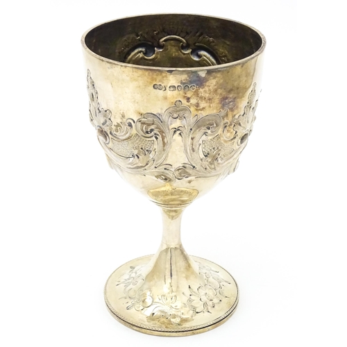 434 - A Victorian silver cup / chalice / goblet with floral and scroll decoration. Hallmarked London 1860 ... 