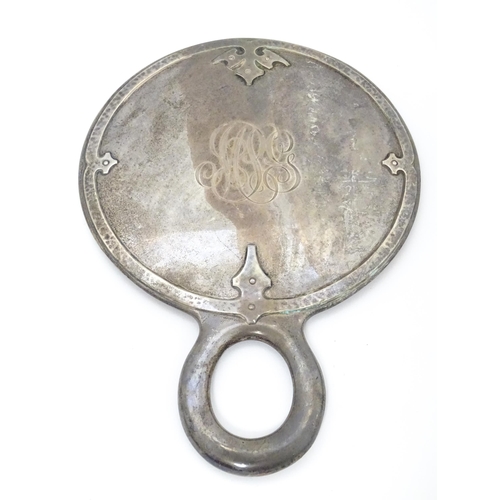 489 - Three American sterling silver backed items comprising two brushes and a hand mirror. Mirror approx.... 