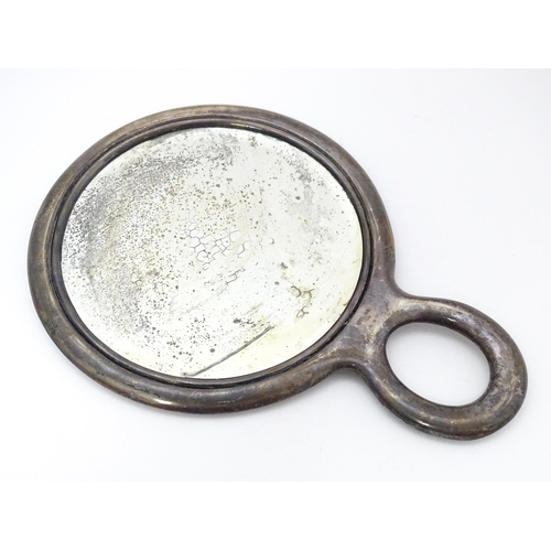 489 - Three American sterling silver backed items comprising two brushes and a hand mirror. Mirror approx.... 