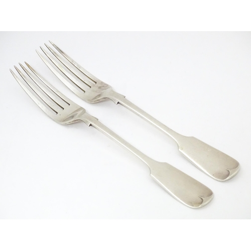 518 - A pair of Victorian silver Fiddle pattern table forks, hallmarked London 1892, maker Francis Higgins... 