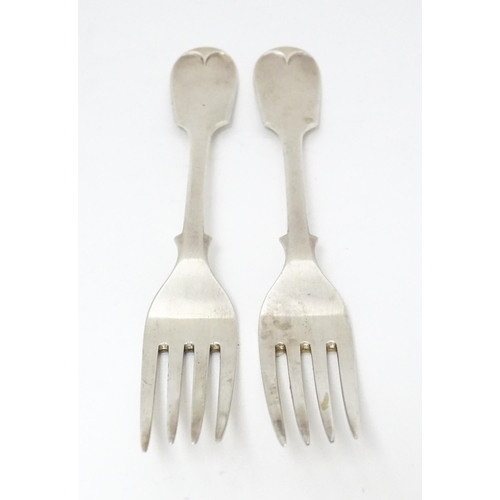 518 - A pair of Victorian silver Fiddle pattern table forks, hallmarked London 1892, maker Francis Higgins... 