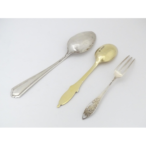 523 - A commemorative silver gilt spoon, the handle surmounted by image of Queen Alexandra, hallmarked She... 