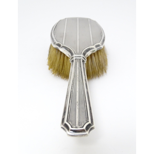 525 - An Art Deco silver backed hair brush with engine turned decoration hallmarked Birmingham 1927, maker... 