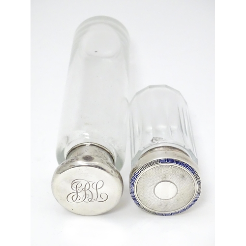 528 - Two glass dressing table jars, one hallmarked Birmingham 1921. Largest approx. 6 1/4