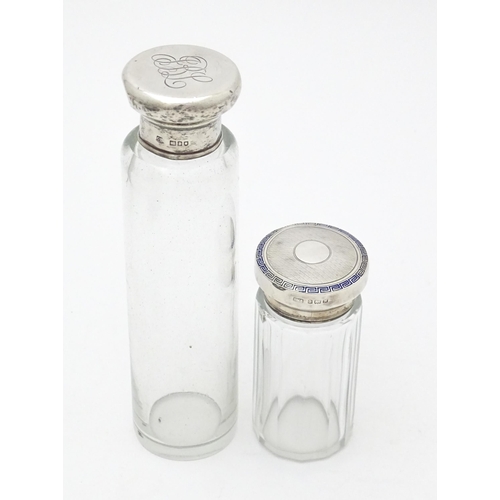 528 - Two glass dressing table jars, one hallmarked Birmingham 1921. Largest approx. 6 1/4