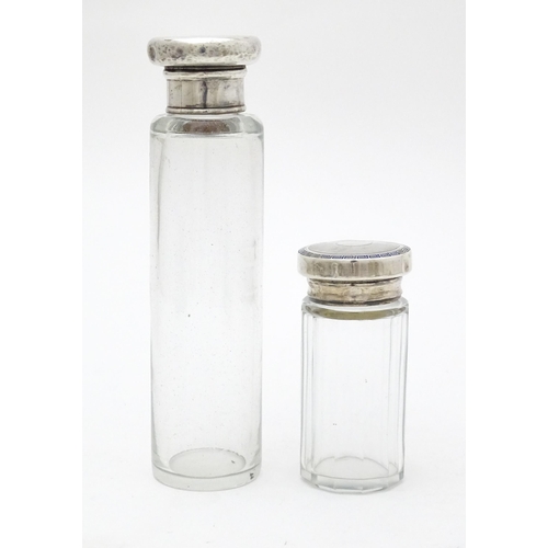 528 - Two glass dressing table jars, one hallmarked Birmingham 1921. Largest approx. 6 1/4