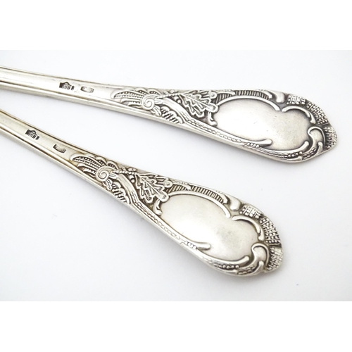 533 - Two Russian / Soviet silver teaspoons with foliate detail to handles, marked 875. Approx. 5 1/4