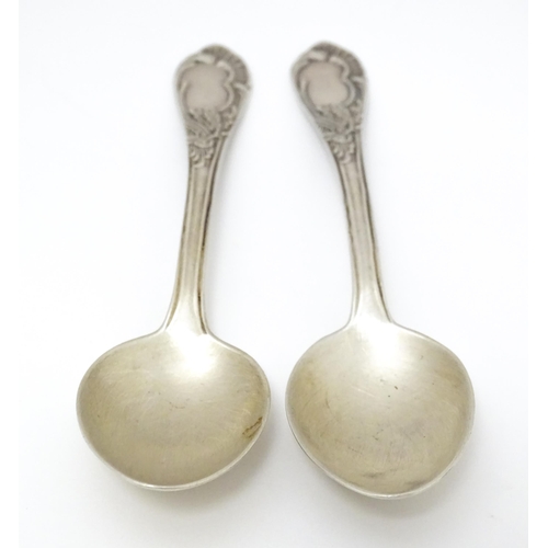 533 - Two Russian / Soviet silver teaspoons with foliate detail to handles, marked 875. Approx. 5 1/4