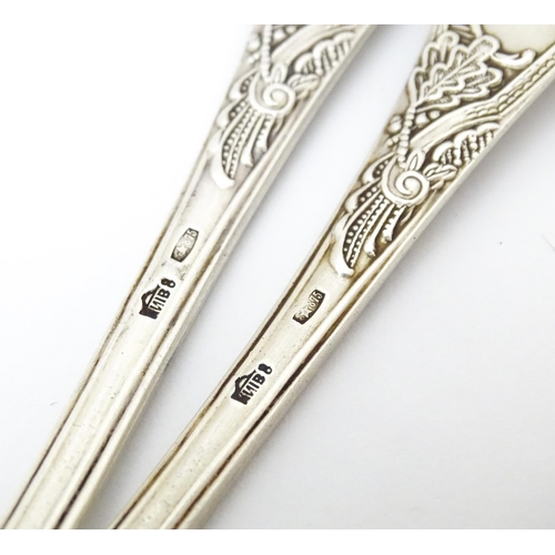 533 - Two Russian / Soviet silver teaspoons with foliate detail to handles, marked 875. Approx. 5 1/4