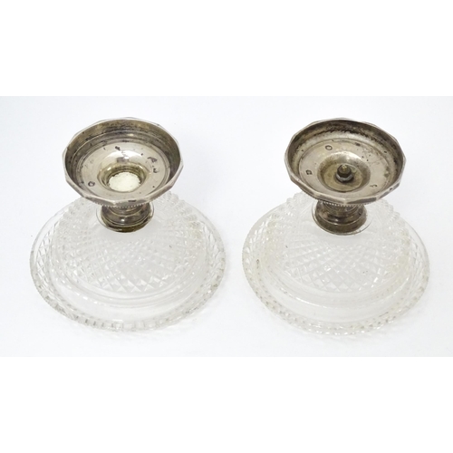 534 - A pair Continental silver and cut glass sweet meat dishes / pedestal salts. Approx. 3 1/2