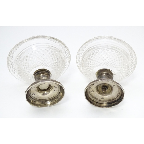 534 - A pair Continental silver and cut glass sweet meat dishes / pedestal salts. Approx. 3 1/2