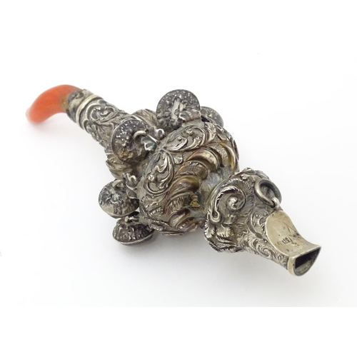 535 - A Victorian silver child's / baby's rattle with whistle to one end, and coral teether to the other, ... 