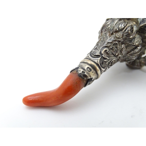 535 - A Victorian silver child's / baby's rattle with whistle to one end, and coral teether to the other, ... 