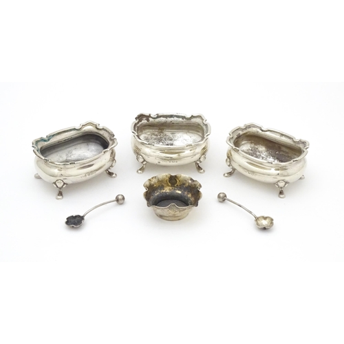 554 - A set of three silver salts hallmarked Birmingham 1926, maker Walker & Hall. Together with a silver ... 