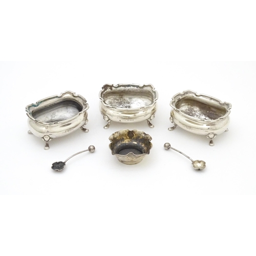 554 - A set of three silver salts hallmarked Birmingham 1926, maker Walker & Hall. Together with a silver ... 