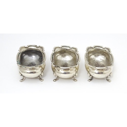 554 - A set of three silver salts hallmarked Birmingham 1926, maker Walker & Hall. Together with a silver ... 