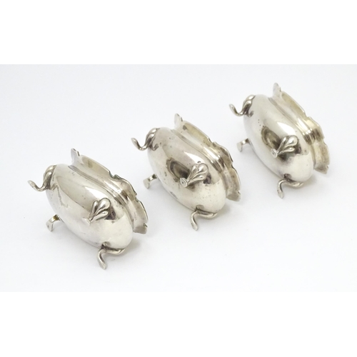 554 - A set of three silver salts hallmarked Birmingham 1926, maker Walker & Hall. Together with a silver ... 