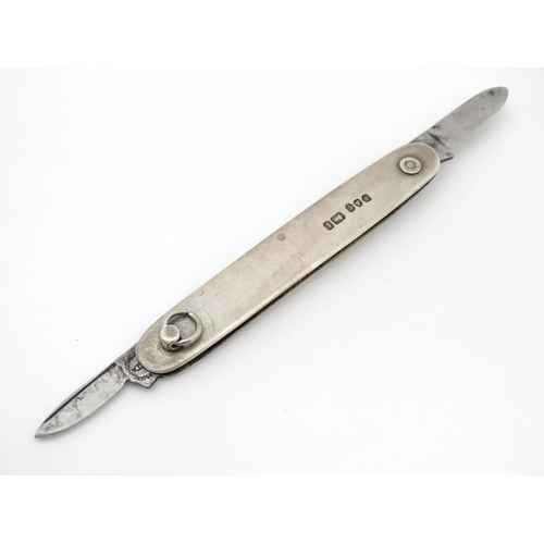 556 - A silver folding twin blade knife, hallmarked Sheffield 1903, maker Brookes & Crookes. Approx. 3