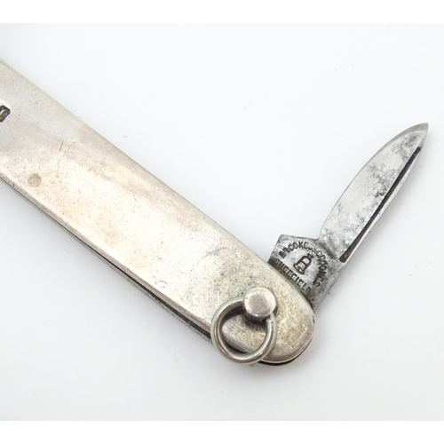 556 - A silver folding twin blade knife, hallmarked Sheffield 1903, maker Brookes & Crookes. Approx. 3